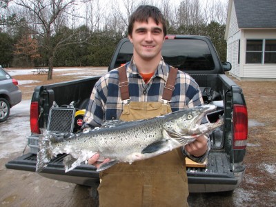 Lance Champney of Milton, Vermont with the huge Atlantic salmon he caught through the ice February 2nd on northern Lake Champlain.