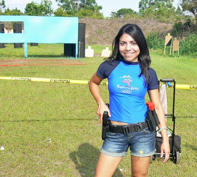 Top Shot Season 4 Competitor Gabby Franco taking a shooting break in her 2000 Olympic souvenir. Photo: Gabby Franco