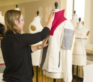A student looks over the solar-powered clothing