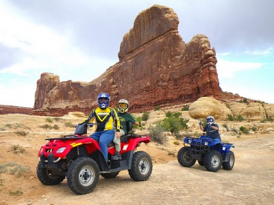 Riding an ATV by a finin Moab, Utah