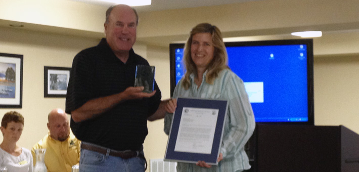 Acting Midwest Regional Director Charlie Wooley presents Dr. Carol Bocetti of the California University of Pennsylvania with the 2011 Recovery Champion Award