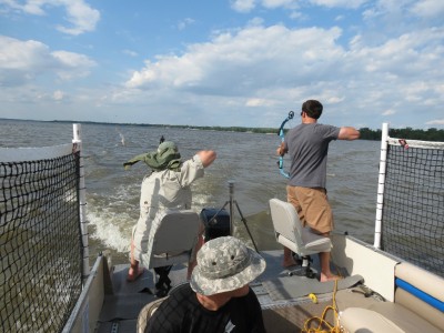 A crew of Carp Hunters takes their shot at the fish jumping out of the water on one of Capt. Nathan Wallick's guided trips.