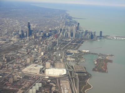 View of downtown Chicago from a plane. Northerly Island is the stretch of green peninsula at the bottom right corner of the frame.