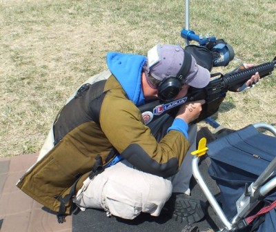 Jeff Lindblon of Rockport, Missouri shoots sitting with a conventional AR-15 service rifle