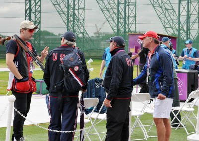 Struggling to figure out what was going wrong, SSG Josh Richmond, U.S. Army Marksmanship Unit, talks it over with the coaching staff in between qualification rounds of the Olympic double trap competition Wednesday at the Royal Artillery Barracks shotgun range. Richmond came up short of an Olympic medal, finishing in 16th place in his Olympic debut.