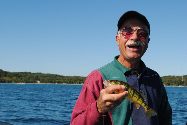 Most times you have to catch a bunch of Crystal Lake perch in order to get a few keepers, like this one, says Jerry Rakoczy.