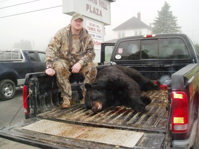 Knox with his 669-pound bear. Image courtesy of John Longergan.