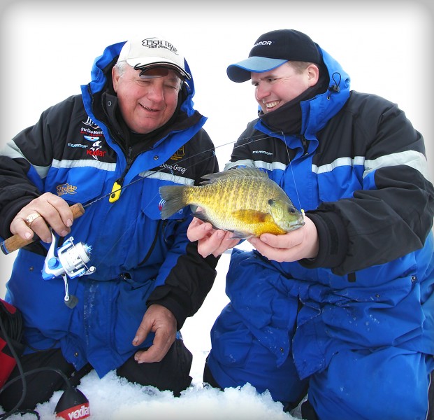 The fishing world mourns the loss of Jim Hudson, shown here smiling with Dave Genz. Whether they were working together or fishing for fun, Genz was extremely impressed by Hudson’s capabilities and personality. “He was headed,” says Genz, “to the top of the ice fishing industry.”