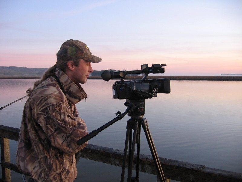 The author's son watching for wildlife while filming. Developing your visual awareness can improve your skills as an outdoorsman and enhance your quality of life.