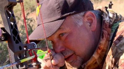 I fumbled around to slide an arrow into the rest and snapped the nock onto the string, all the while the three buffalo bulls stood at full alert staring intently at us.