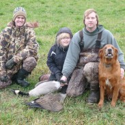 Todd Achterhof, Andrea and Kevin Essenburg, and Gabe pose with two geese taken at the Fennville Farm Managed Hunt Unit in southwest Michigan.