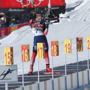 A competitor takes aim in one of the shooting portions of a 20-kilometer biathlon event at the 2006 Winter Olympics in Torino.