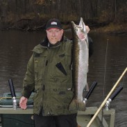 Miles Hanley built an affordable steelhead boat so he could catch river fish, like this 12-pounder.
