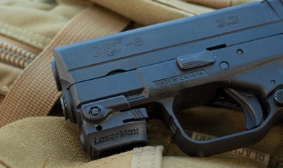 Even a pocket-sized gun like this Springfield Armory XD-S can be equipped with a laser, like this LaserMax Mini.
