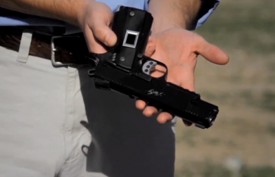 Personalized handguns such as this Intelligun-equiped 1911 pistol, are designed to be capable of firing only when held by their owners.