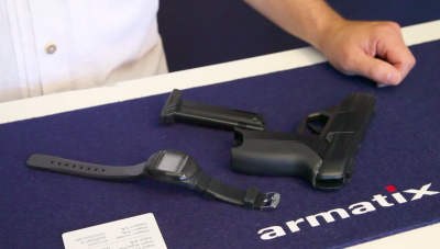 The Armatix iP1 pistol with its accompanying RFID watch.
