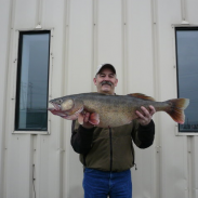 John Grubenoff holds his state record walleye for the camera.