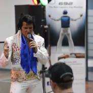 An Elvis impersonator at Beretta Australia's Model 692 launch. The disputed ad poster can be seen in the background.