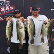 First-place finishers Eric Wright (left) and Jeremy Sims (right) hold up their winning fish at the Texas Team Trail Event at Lake Texoma on Saturday, April 12.