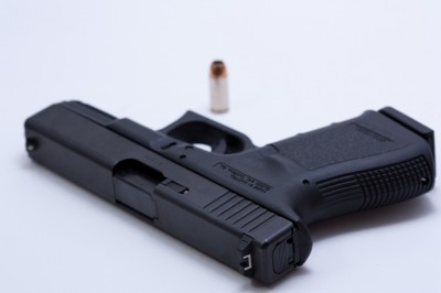 Two Glock executives stand accused of taking more than $1 million in bribes.