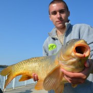 Austin Pass of Allen Park displays a nice carp he caught on his way to winning a wooden shoe for the most cumulative weight of eight fish.