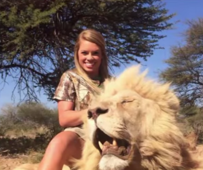 Texas Tech cheerleader Kendall Jones with a lion she harvested.