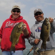 Greg Sochocki, left, and Jaime Ayala compare Saginaw Bay smallmouth bass.