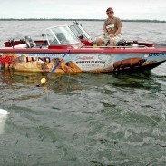 Wind activates predator fish like walleyes, so learning to safely and efficiently control your boat on wind-driven spots can help you catch many more fish. Here, Ted Takasaki is using a drift sock (white thing at lower left) and bow-mounted electric motor to position his boat over a likely walleye hideout.