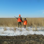 In this photo from day three of the author's SoDak pheasant hunt, Jodi and Sophie Stemler "block," a method used to keep birds from flying out of the opposite end of a field as hunters walk through it.