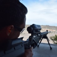 Colin Anthony prepares to fire the TrackingPoint BA 300 WM at SHOT Show 2015's Industry Day. Image by Matt Korovesis.