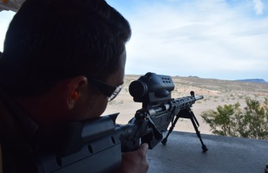 Colin Anthony prepares to fire the TrackingPoint BA 300 WM at SHOT Show 2015's Industry Day. Image by Matt Korovesis.