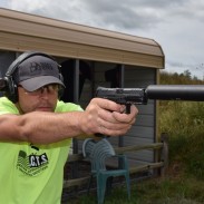 Matt Ohrstrom shoots an HK VP9 with a suppressor. Image by Matt Korovesis.