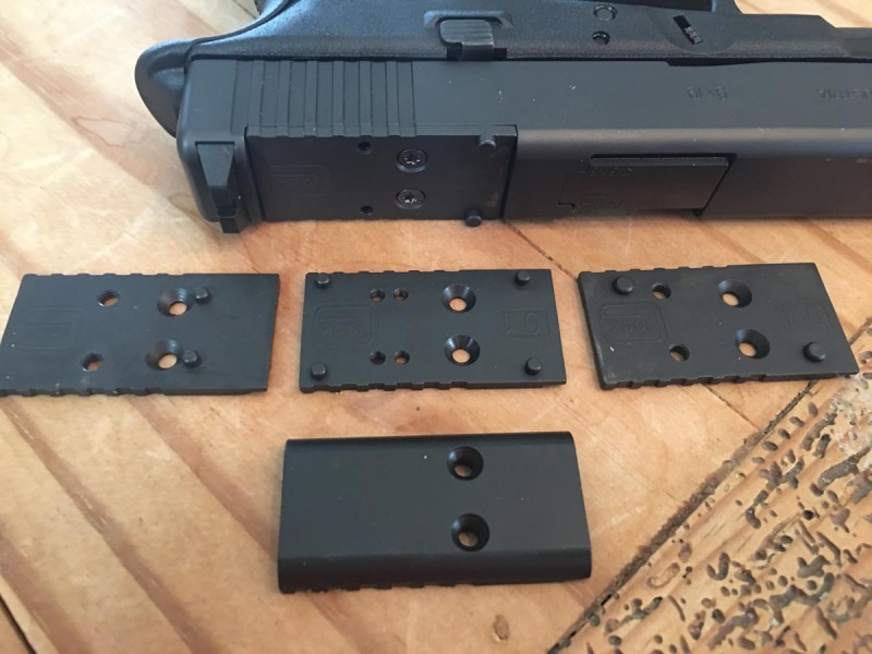 Four different mounting plates are in the box to fit a variety of optics. 