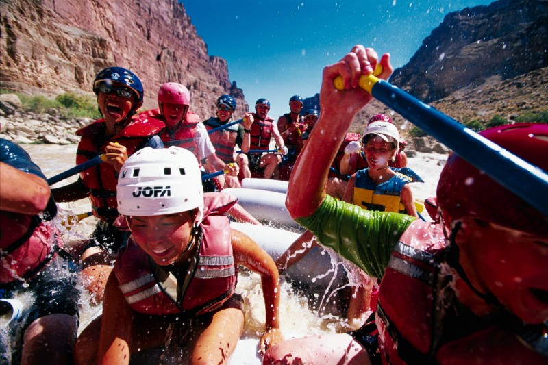Paddlers raft their way down the Colorado River for Moab, Utah's Raft for the Cure.