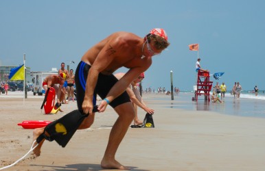 Lifeguards must paddle, swim, and run during the competition.